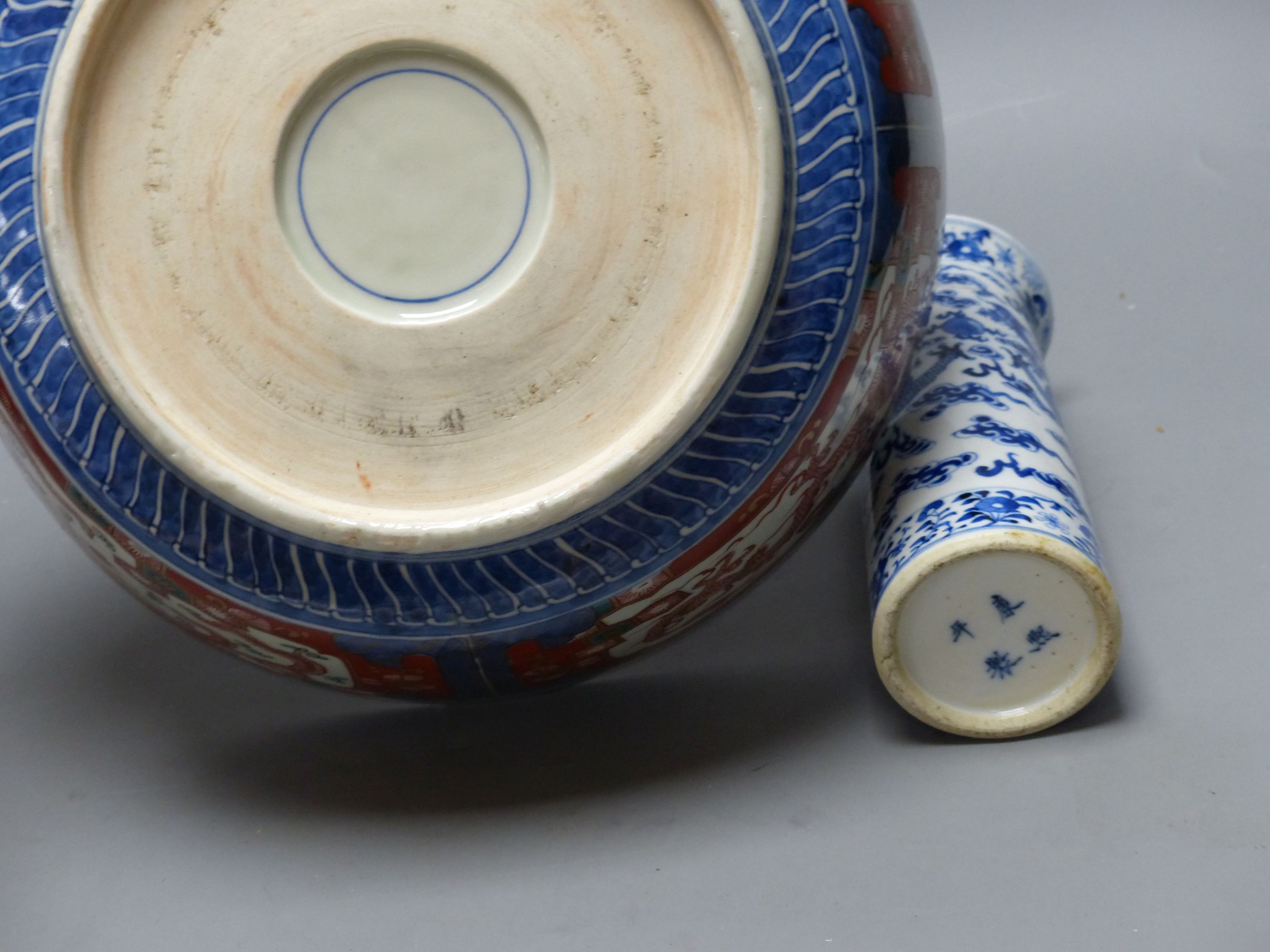 A large Japanese Imari bowl, Meiji period, diameter 31cm, and a Chinese blue and white sleeve vase